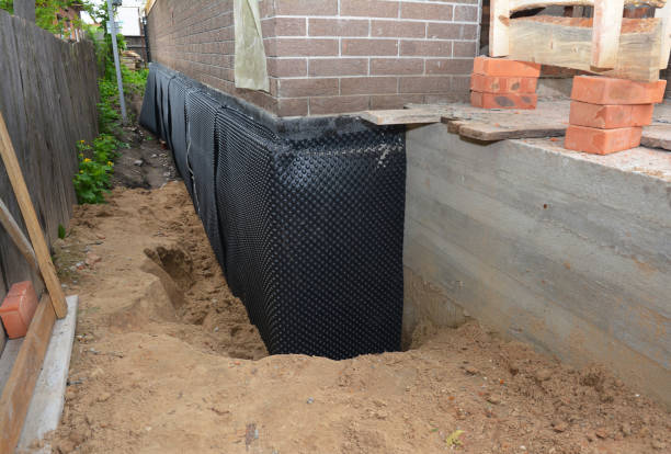 Happy homeowners after waterproofing job in Millwood